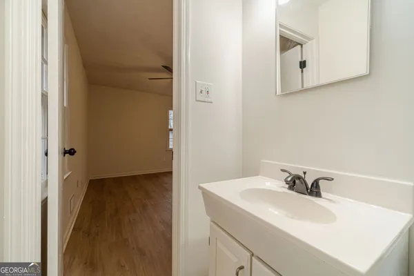 a bathroom with a sink and a mirror