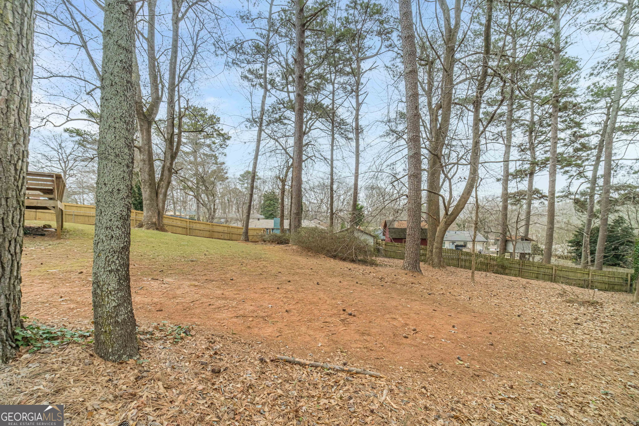 1678 Pounds Road Southwest Stone Mountain, GA 30087 - Photo 29 of 30 a backyard of a house with lots of green space