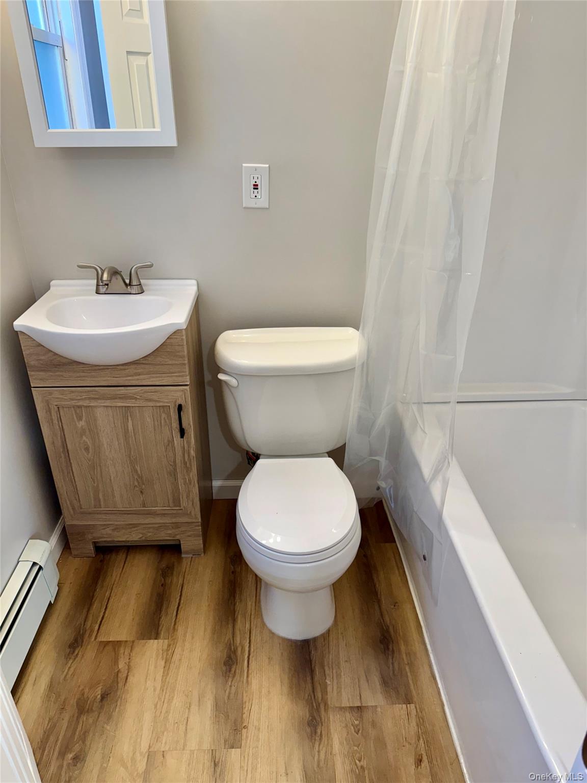 28 B Knapp Road Stony Point, NY 10980 - Photo 4 of 7 a bathroom with a sink a toilet and a mirror