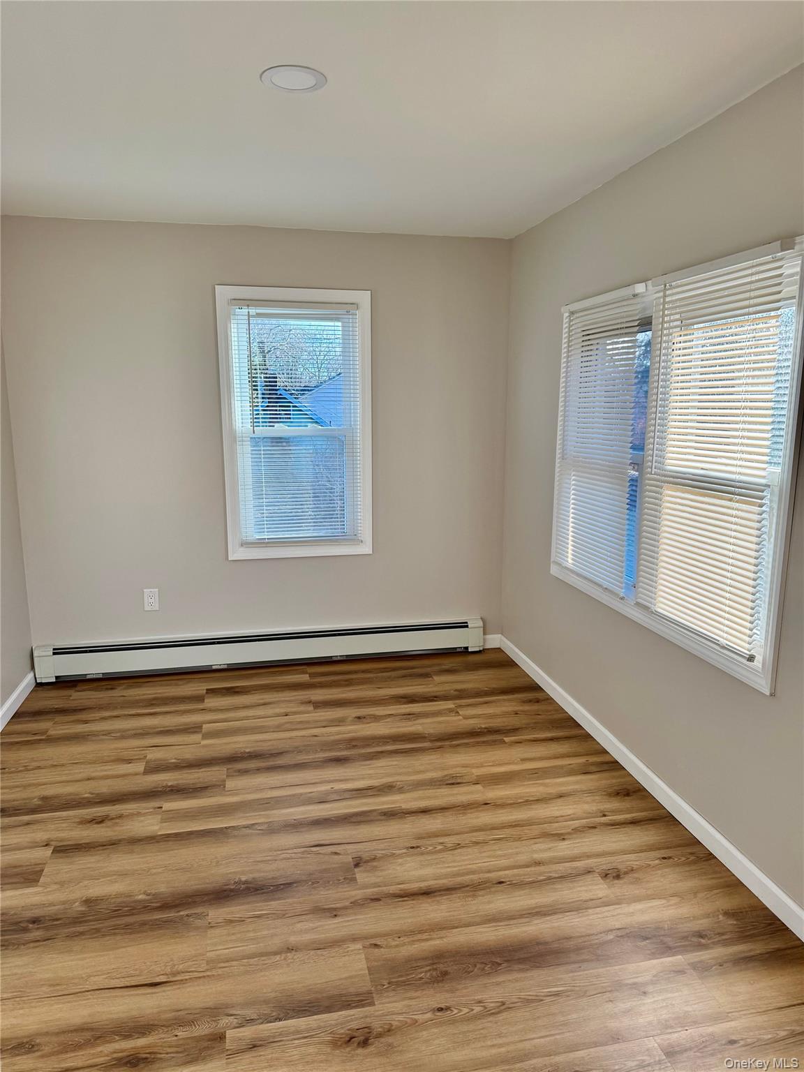 28 B Knapp Road Stony Point, NY 10980 - Photo 6 of 7 a view of an empty room with wooden floor and a window