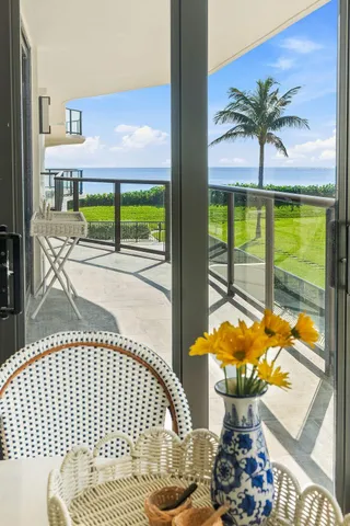 a picture of a floor to ceiling window with a swimming pool