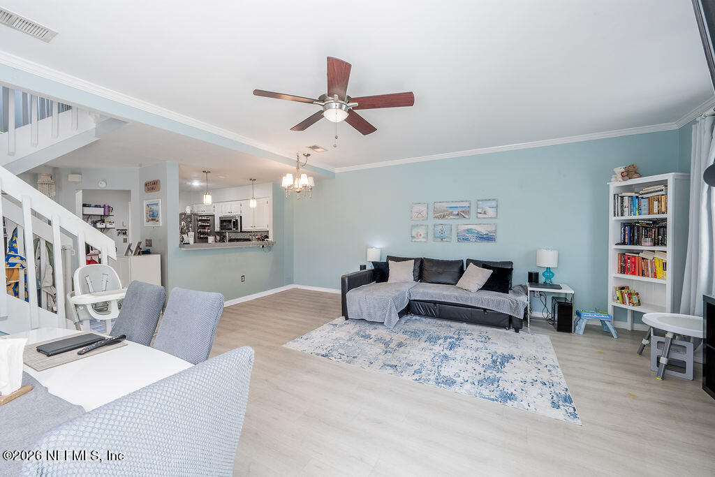 127 Sand Castle Way Neptune Beach, FL 32266 - Photo 11 of 36 a bedroom with a bed a couch and dresser