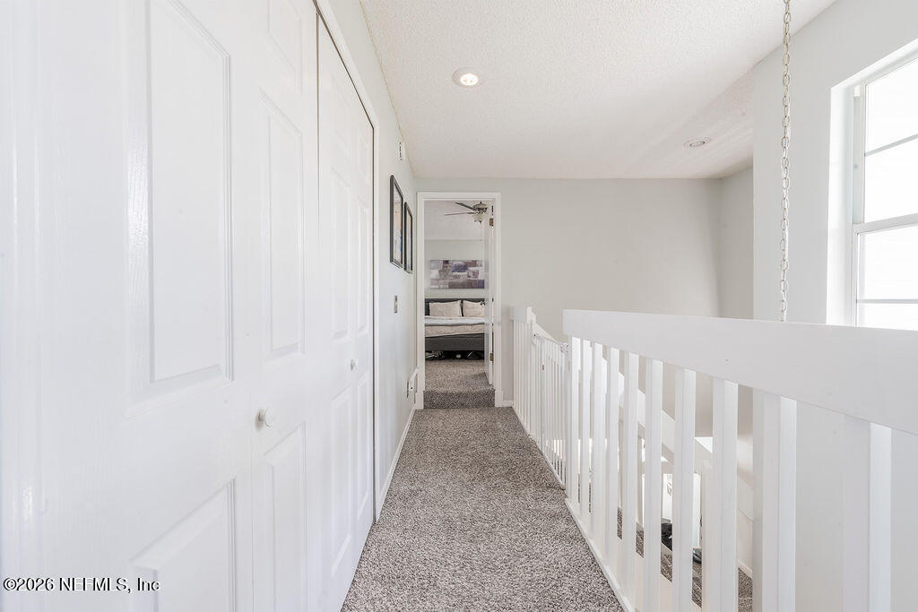 127 Sand Castle Way Neptune Beach, FL 32266 - Photo 19 of 36 a view of a hallway with wooden floor and entryway