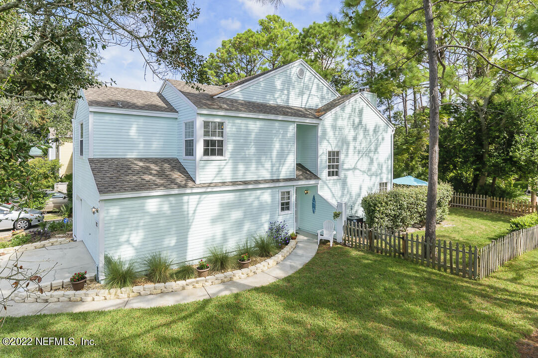 127 Sand Castle Way Neptune Beach, FL 32266 - Photo 2 of 36 a front view of a house with garden
