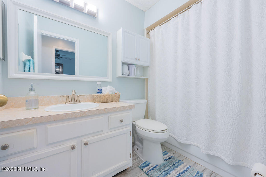 127 Sand Castle Way Neptune Beach, FL 32266 - Photo 24 of 36 a bathroom with a sink toilet and a mirror