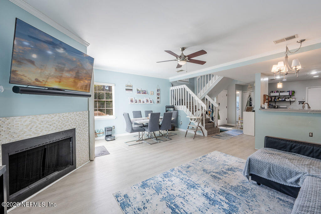 127 Sand Castle Way Neptune Beach, FL 32266 - Photo 10 of 36 a view of a livingroom with furniture and a fireplace