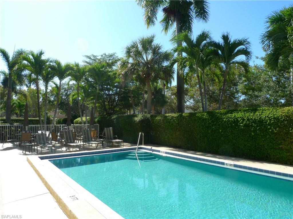 72 7th Street South, Unit 203 Naples, FL 34102 - Photo 16 of 23 a view of a swimming pool with a lake view