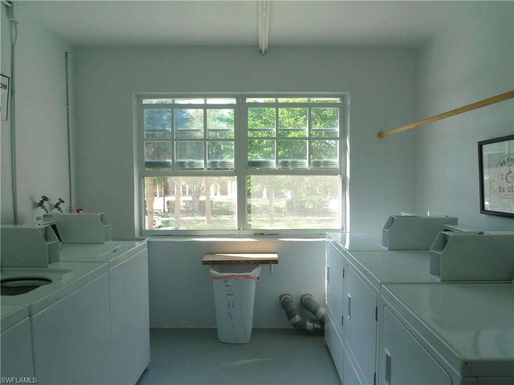 72 7th Street South, Unit 203 Naples, FL 34102 - Photo 19 of 23 a room with a sink and large window