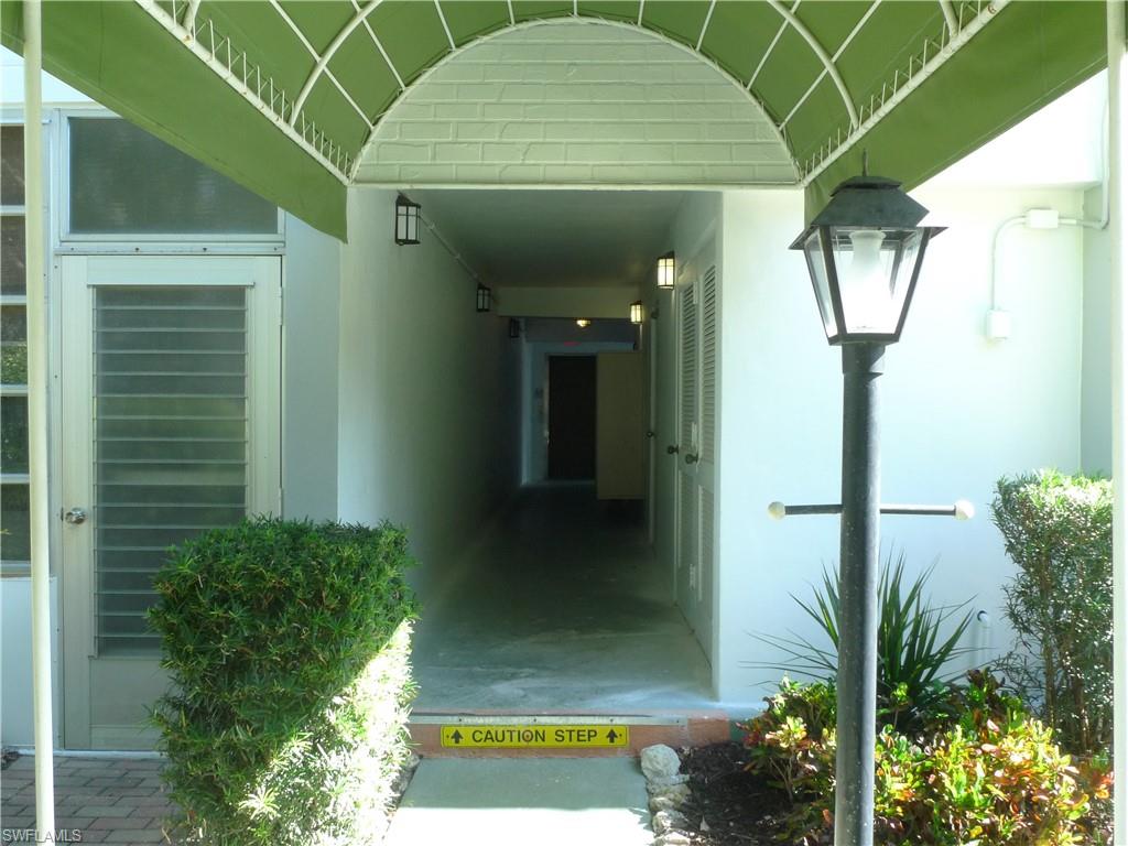 72 7th Street South, Unit 203 Naples, FL 34102 - Photo 2 of 23 a view of a entryway door front of house