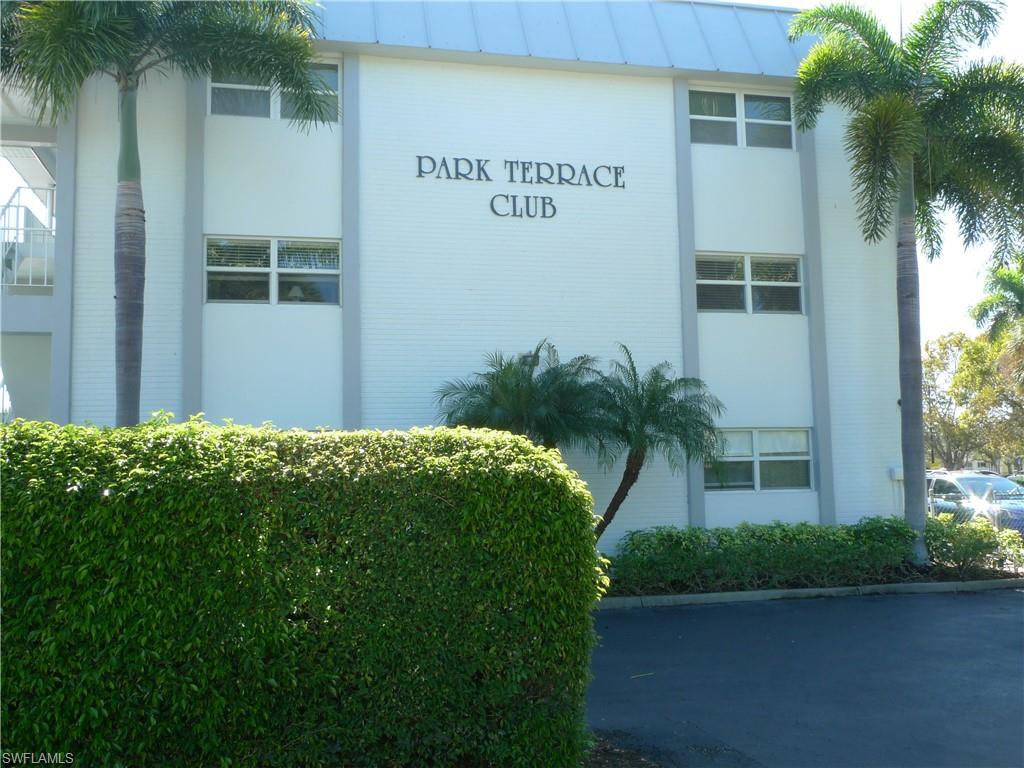 72 7th Street South, Unit 203 Naples, FL 34102 - Photo 22 of 23 a front view of a house with garden