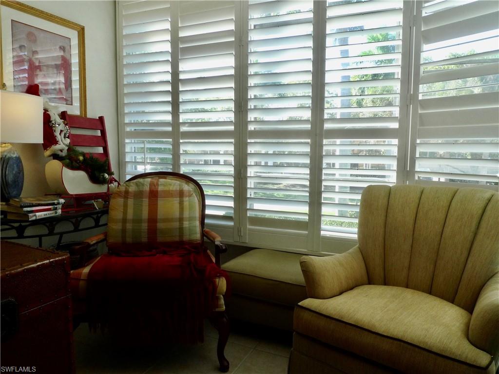 72 7th Street South, Unit 203 Naples, FL 34102 - Photo 7 of 23 a living room with furniture and a window