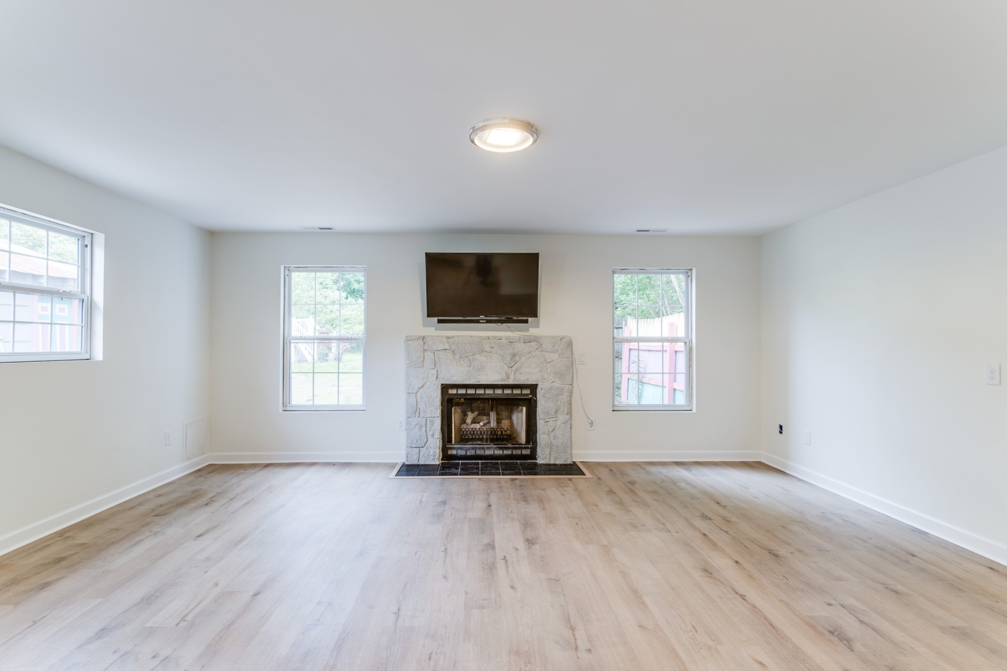 1008 South Spring Street Manchester, TN 37355 - Photo 38 of 60 This inviting space features a brand-new gas fireplace, perfect for cozy gatherings and relaxation during cooler months.