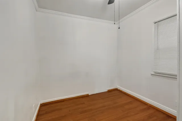 a view of a small space with wooden floor