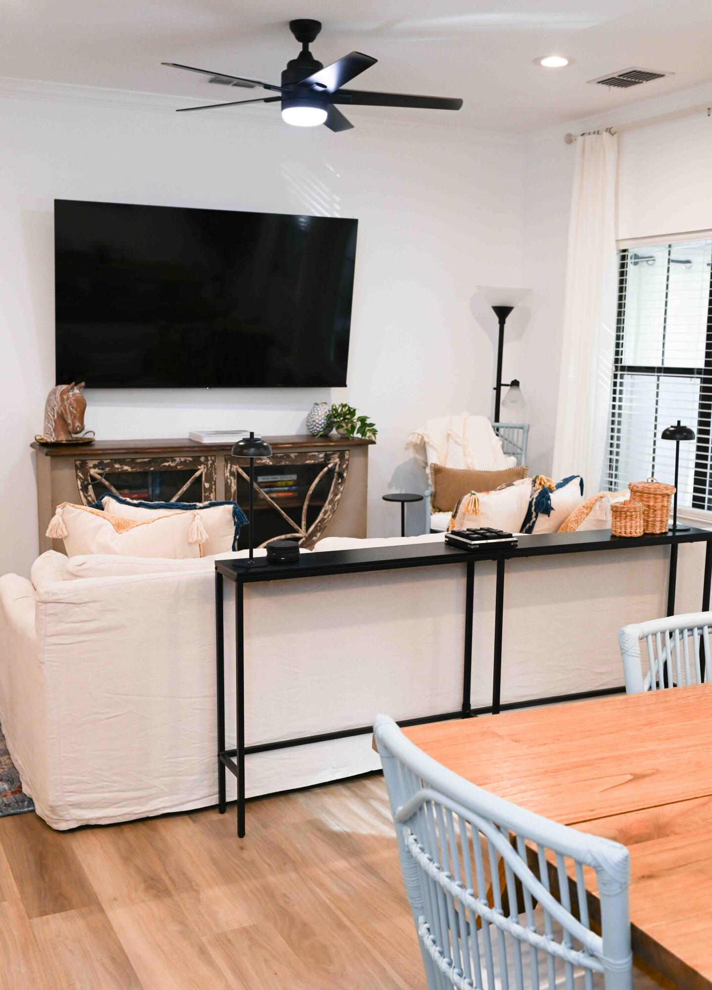 a room with furniture and flat screen tv