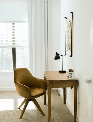 a view of living room and bedroom with windows