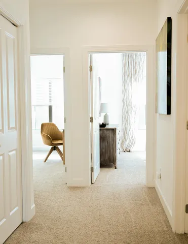 a bedroom with a bed and a mirror