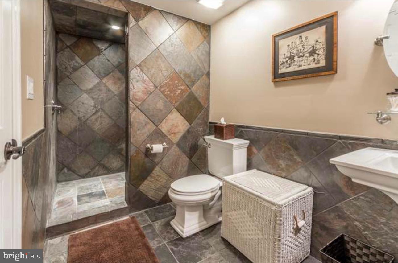 29 South Elmwood Road Marlton, NJ 08053 - Photo 11 of 24 a white toilet sitting next to a bathroom sink