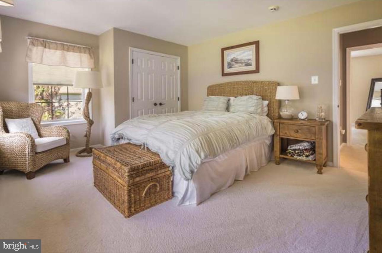 29 South Elmwood Road Marlton, NJ 08053 - Photo 12 of 24 a spacious bedroom with a bed and a couch