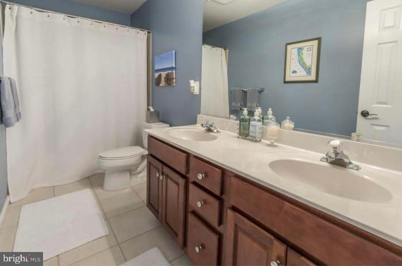 29 South Elmwood Road Marlton, NJ 08053 - Photo 13 of 24 a bathroom with a sink a toilet and a mirror