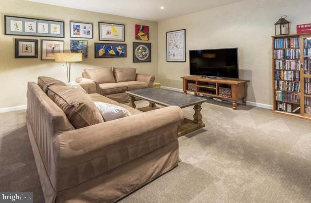 29 South Elmwood Road Marlton, NJ 08053 - Photo 16 of 24 a living room with furniture and a flat screen tv