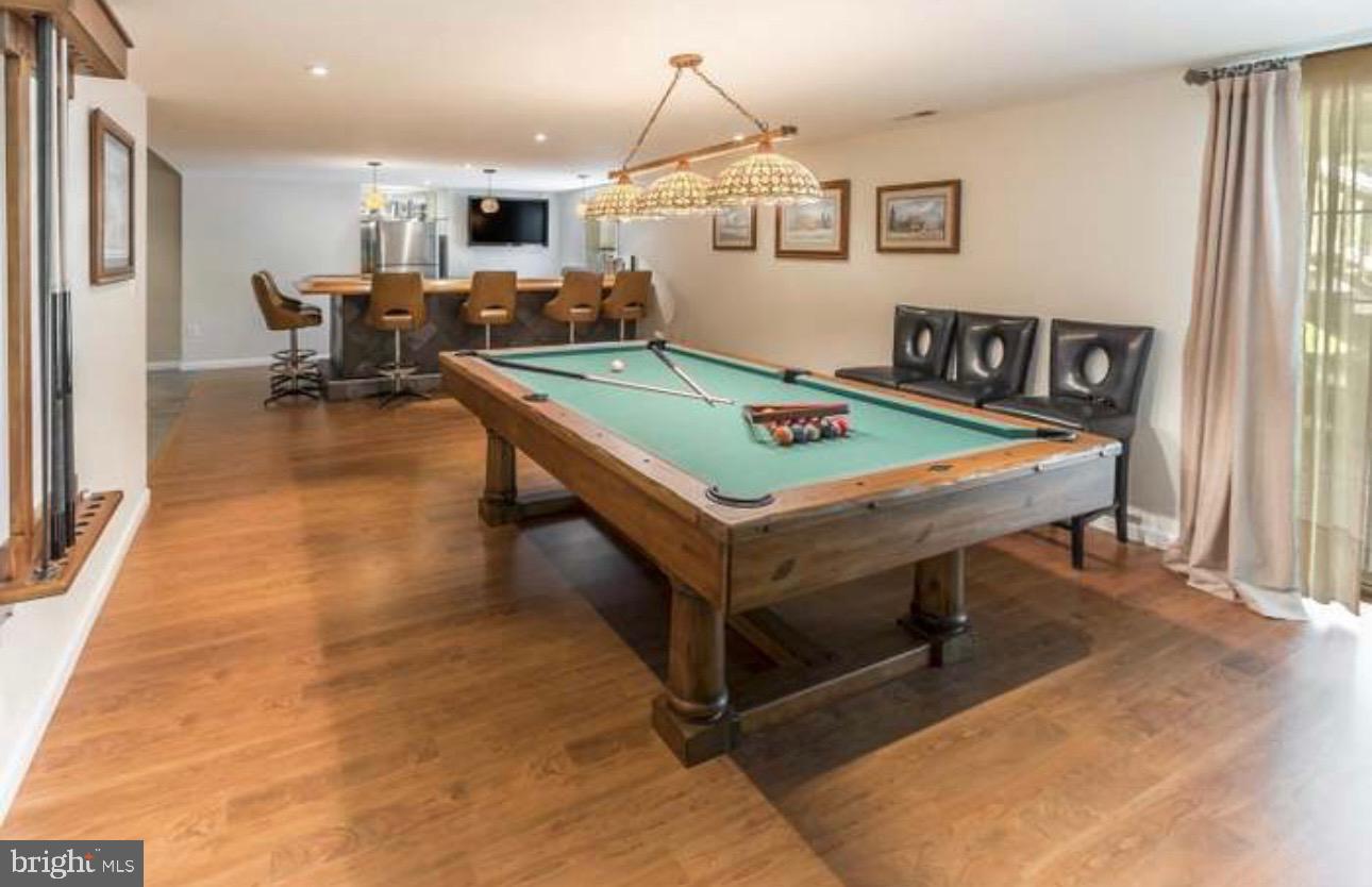 29 South Elmwood Road Marlton, NJ 08053 - Photo 17 of 24 a living room with pool table and a flat screen tv