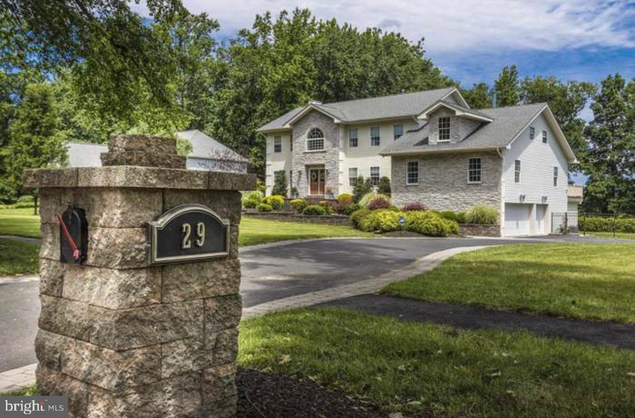 29 South Elmwood Road Marlton, NJ 08053 - Photo 2 of 24 a front view of a house with a garden and plants