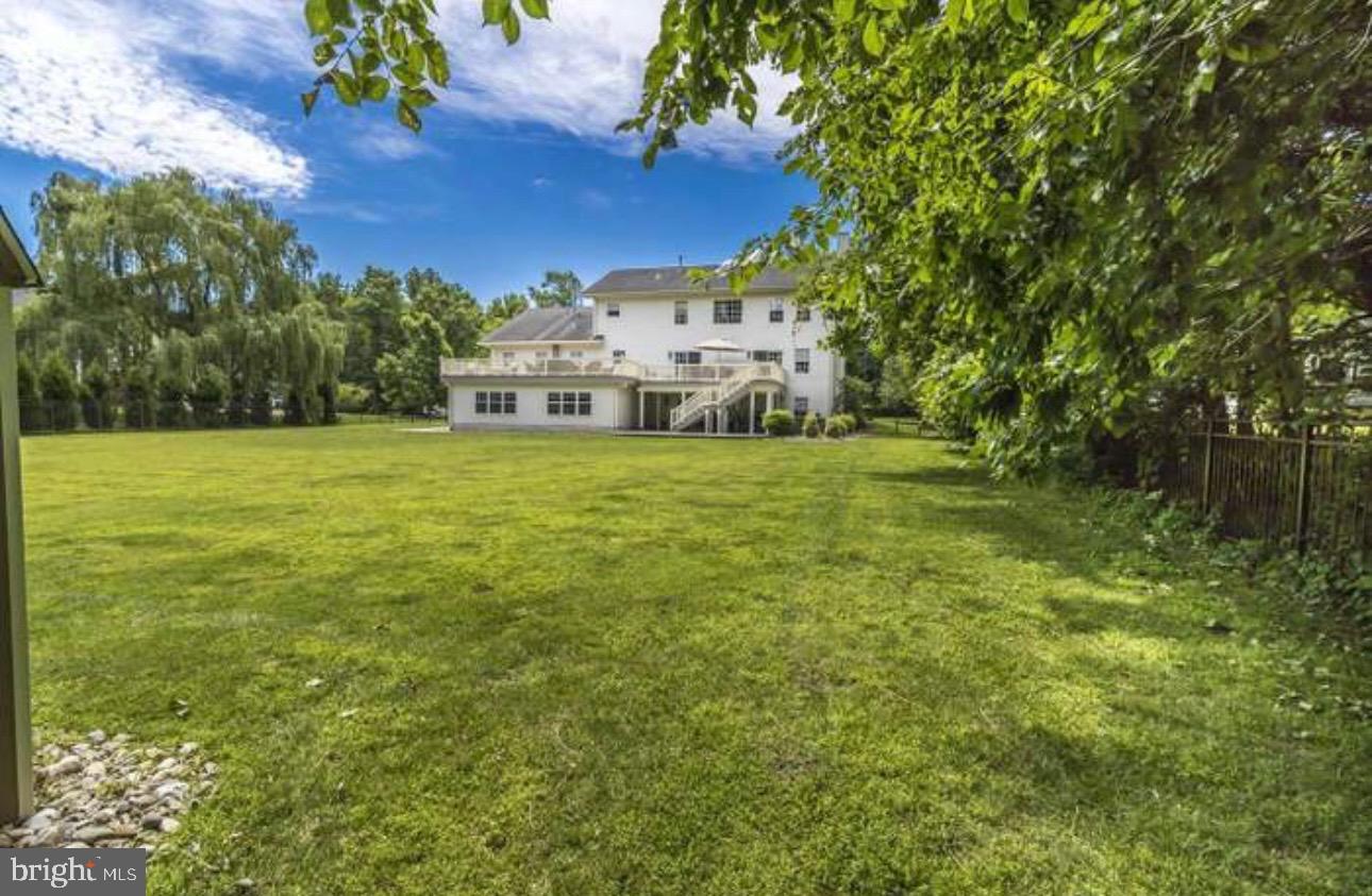 29 South Elmwood Road Marlton, NJ 08053 - Photo 23 of 24 a view of a big yard with a house in the background