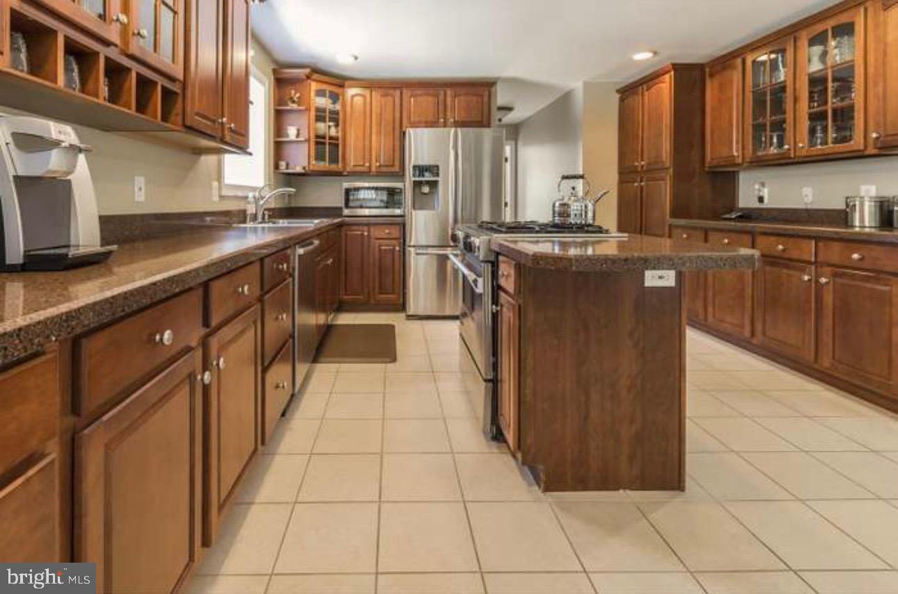 29 South Elmwood Road Marlton, NJ 08053 - Photo 9 of 24 a kitchen with stainless steel appliances granite countertop a stove a sink dishwasher and a refrigerator