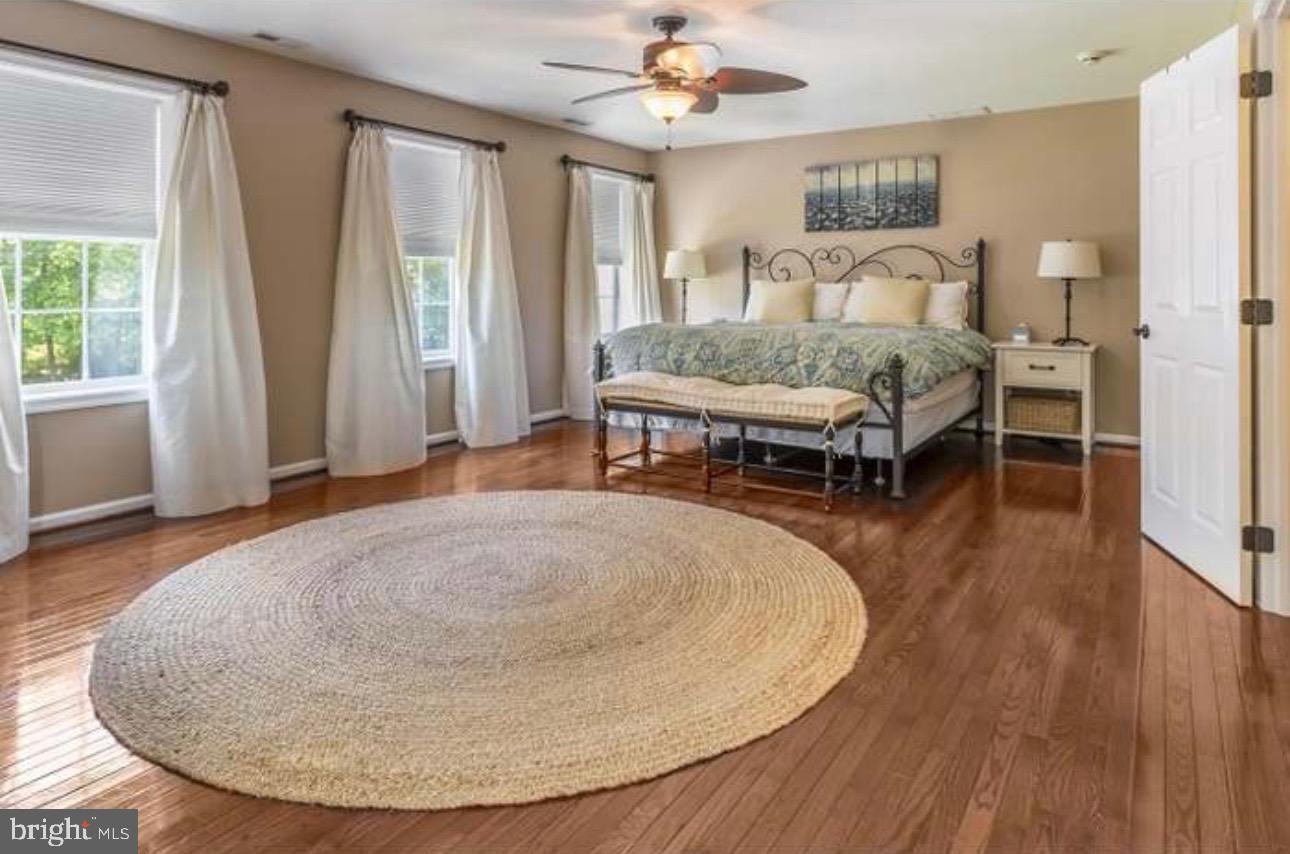 29 South Elmwood Road Marlton, NJ 08053 - Photo 10 of 24 a living room with a bed and a table