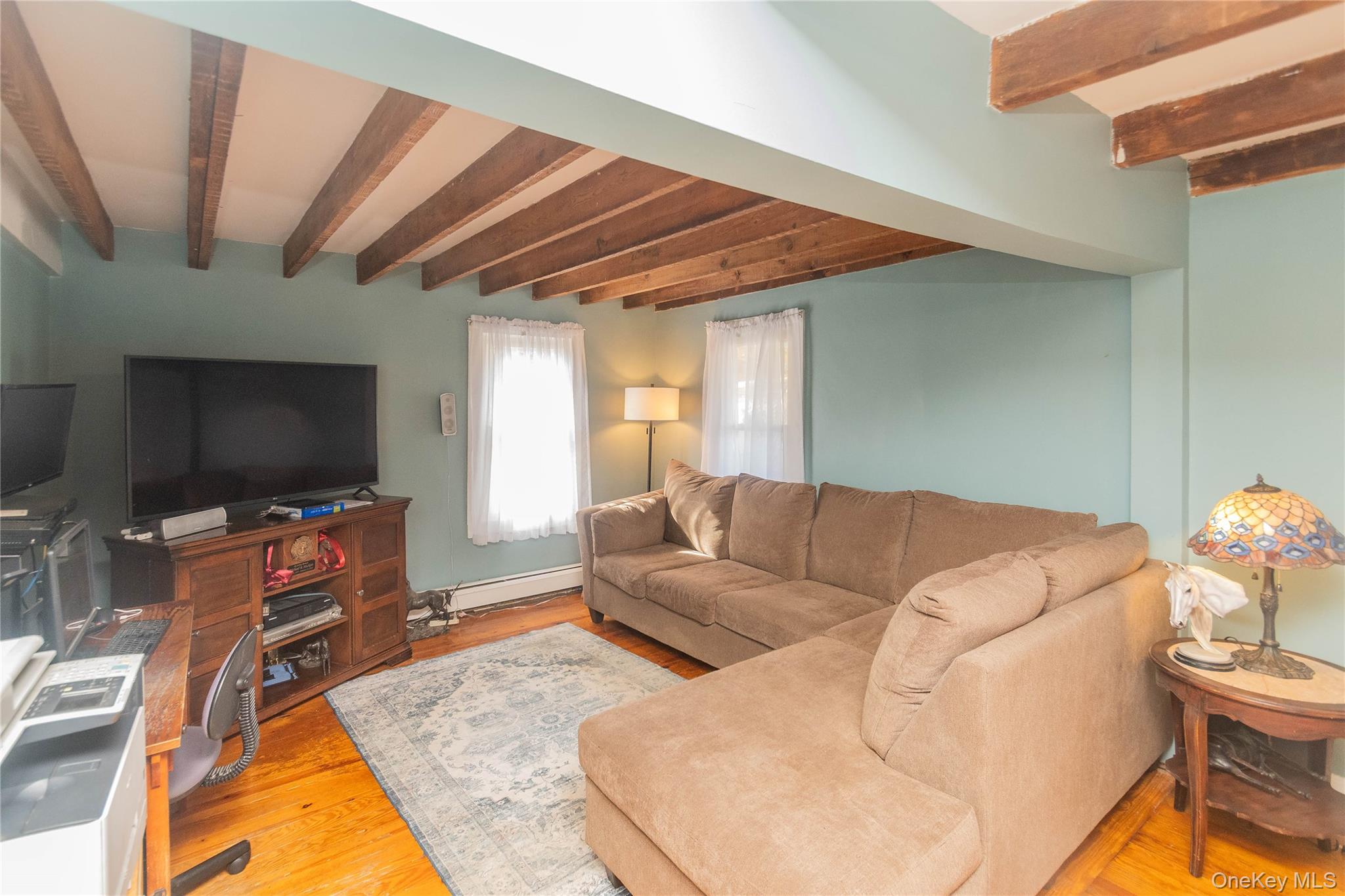 269 Orchard Road Highland, NY 12528 - Photo 11 of 24 a living room with furniture and a flat screen tv