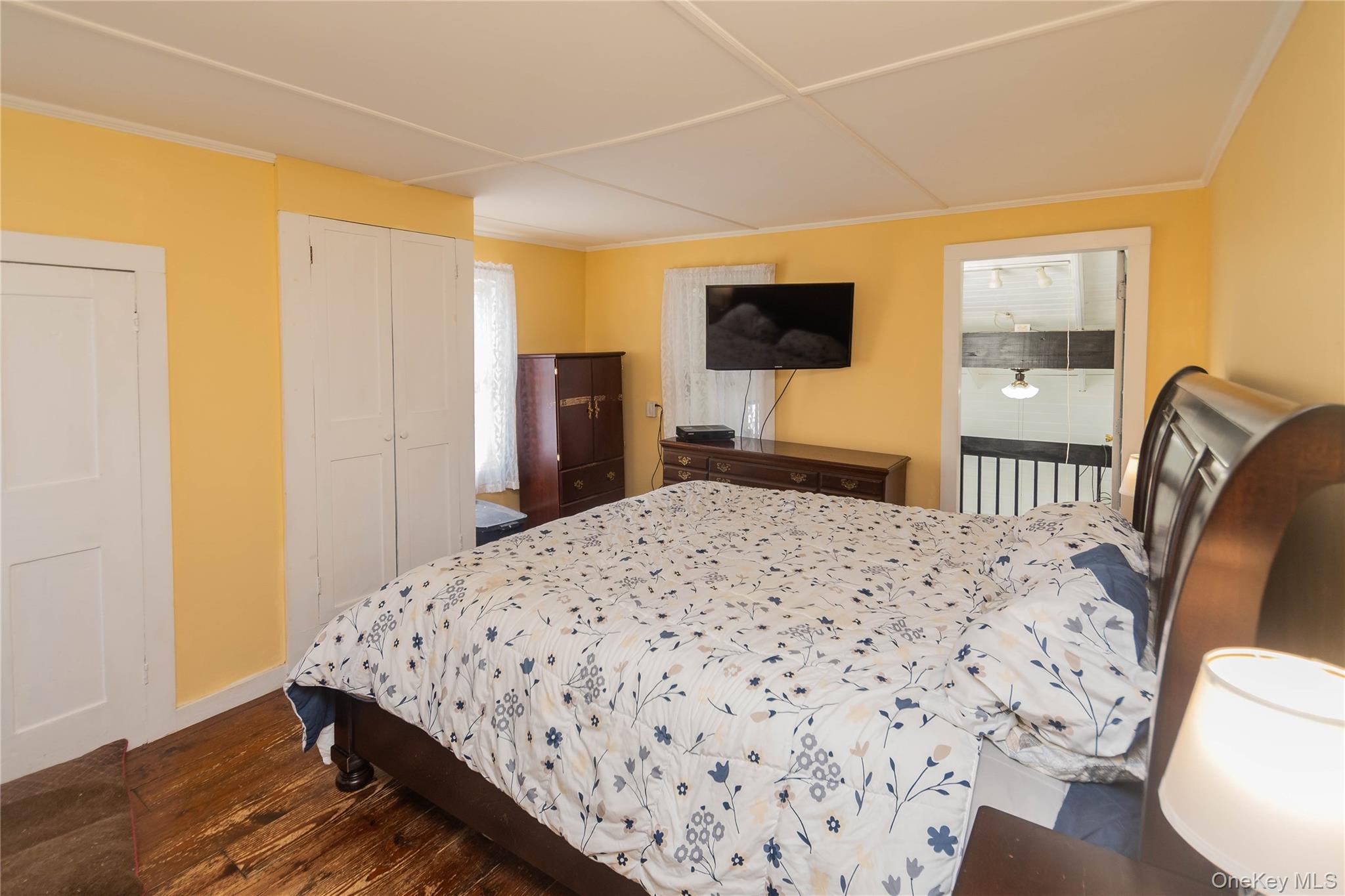 269 Orchard Road Highland, NY 12528 - Photo 12 of 24 a bedroom with a bed and a flat screen tv