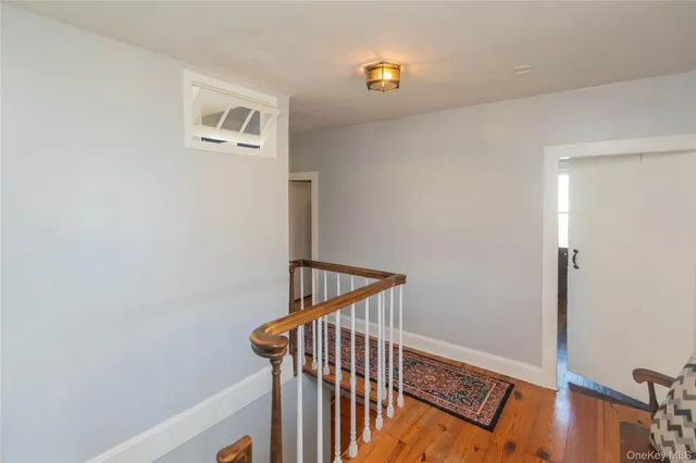 a view of a hallway with staircase