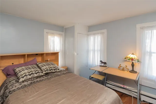 a bedroom with a bed and window