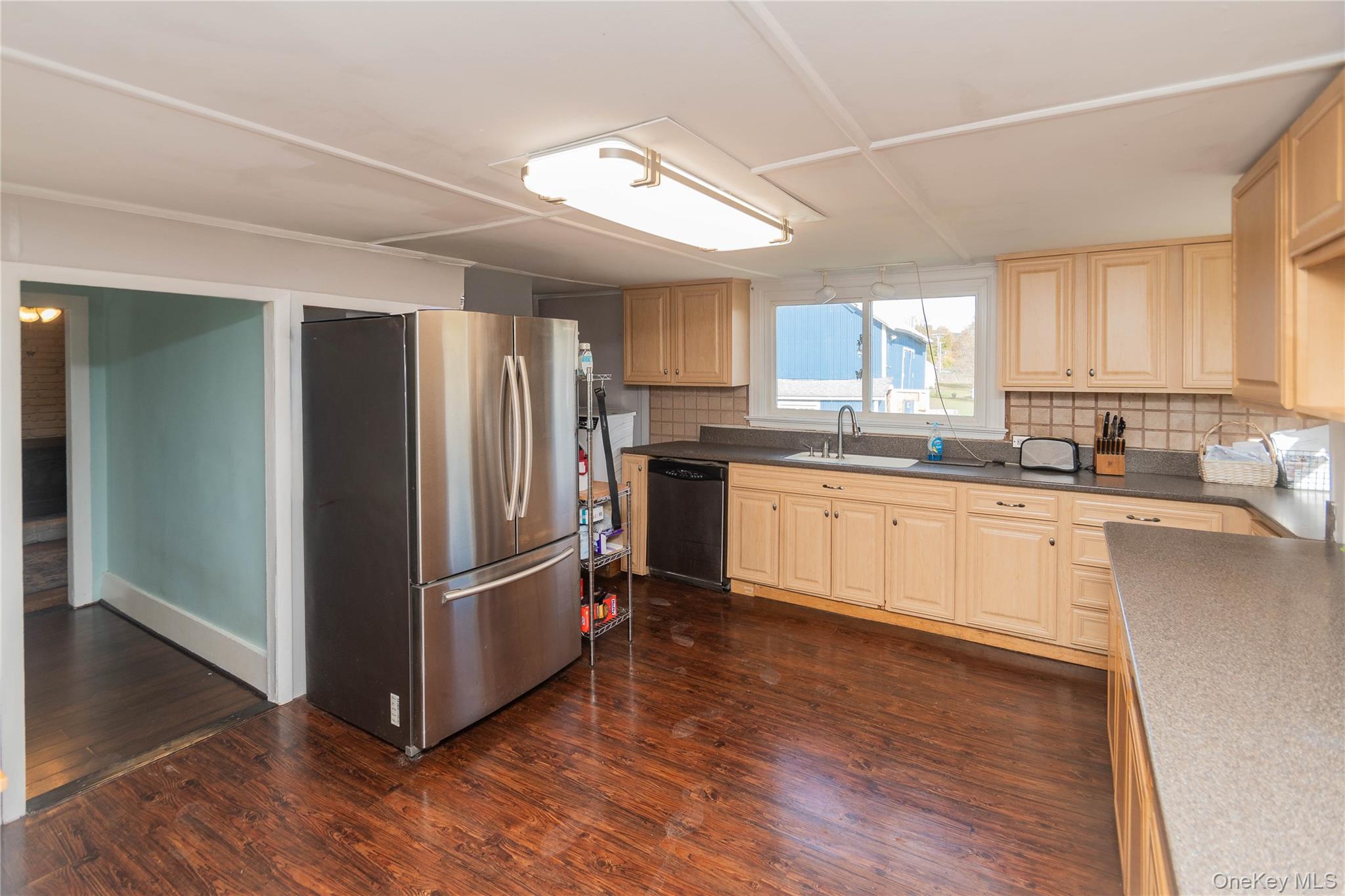 269 Orchard Road Highland, NY 12528 - Photo 5 of 24 a kitchen with stainless steel appliances granite countertop a refrigerator a sink a stove a microwave and cabinets