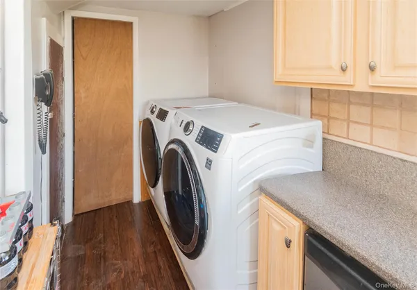 a utility room with dryer and washer