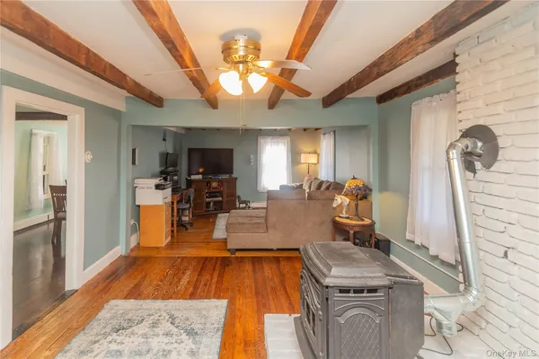 a view of a living room and kitchen with furniture