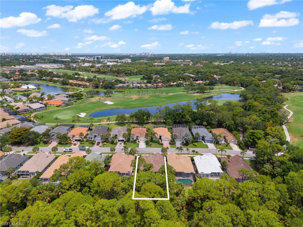 1717 Winding Oaks Way Naples, FL 34109 - Photo 2 of 35 Drone / aerial view featuring a water view