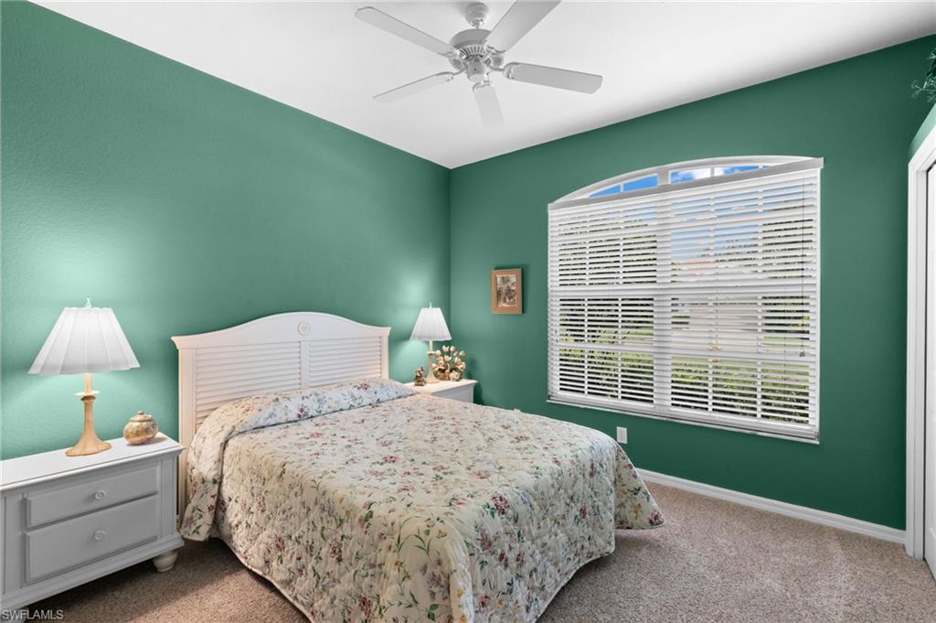 1717 Winding Oaks Way Naples, FL 34109 - Photo 22 of 35 Bedroom with carpet and ceiling fan