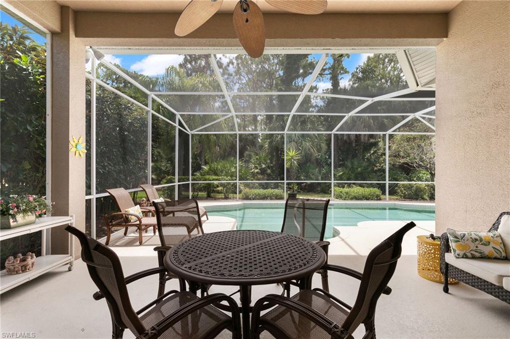 1717 Winding Oaks Way Naples, FL 34109 - Photo 26 of 35 Sunroom with a healthy amount of sunlight and ceiling fan