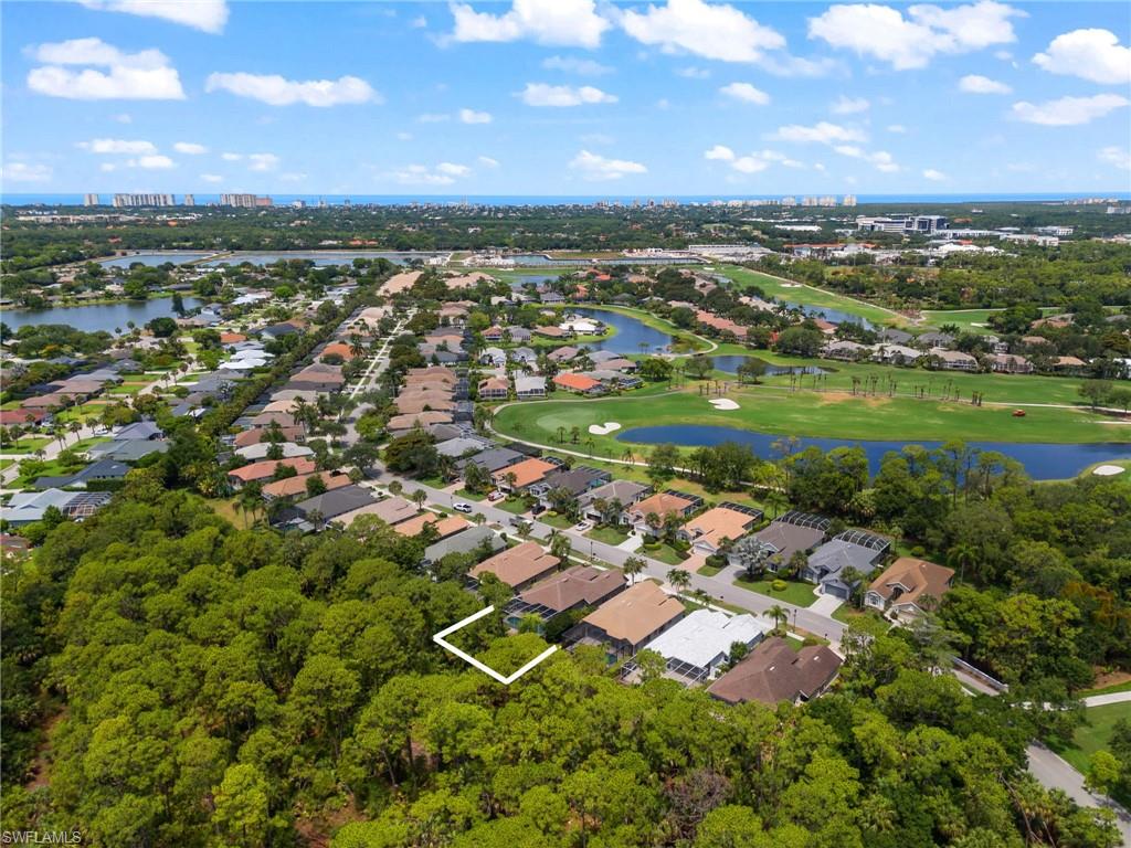 1717 Winding Oaks Way Naples, FL 34109 - Photo 33 of 35 Birds eye view of property with a water view