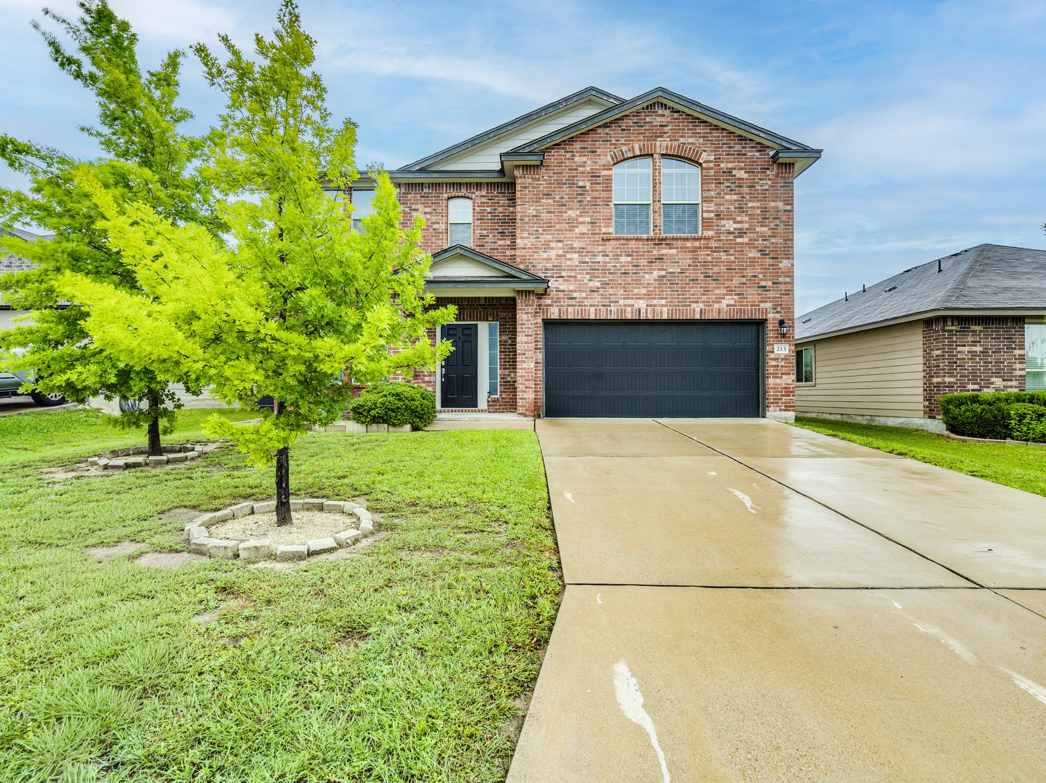 a front view of a house with a yard
