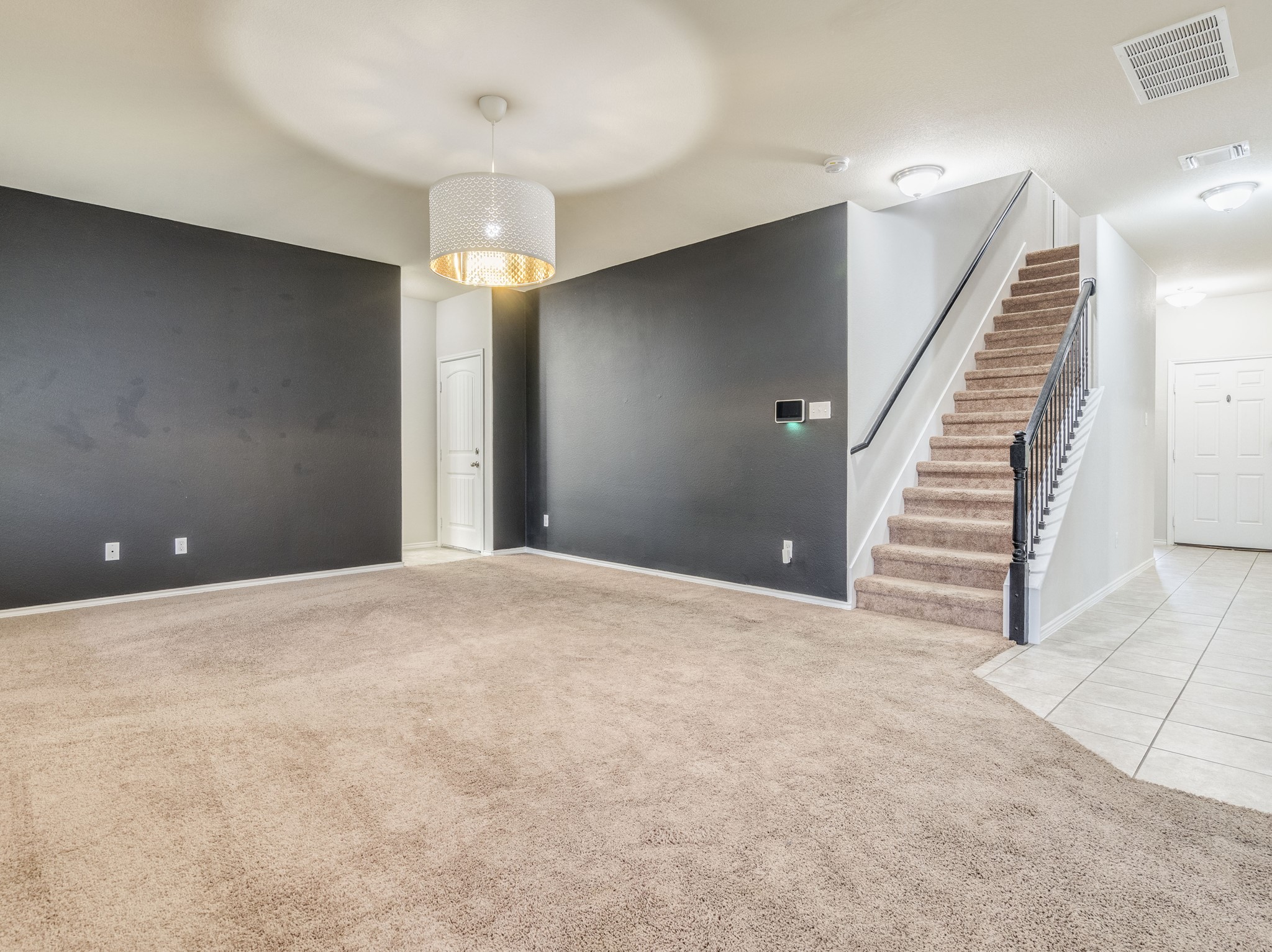 213 Ammonite Lane Jarrell, TX 76537 - Photo 11 of 34 a view of an empty room with stairs and ventilation