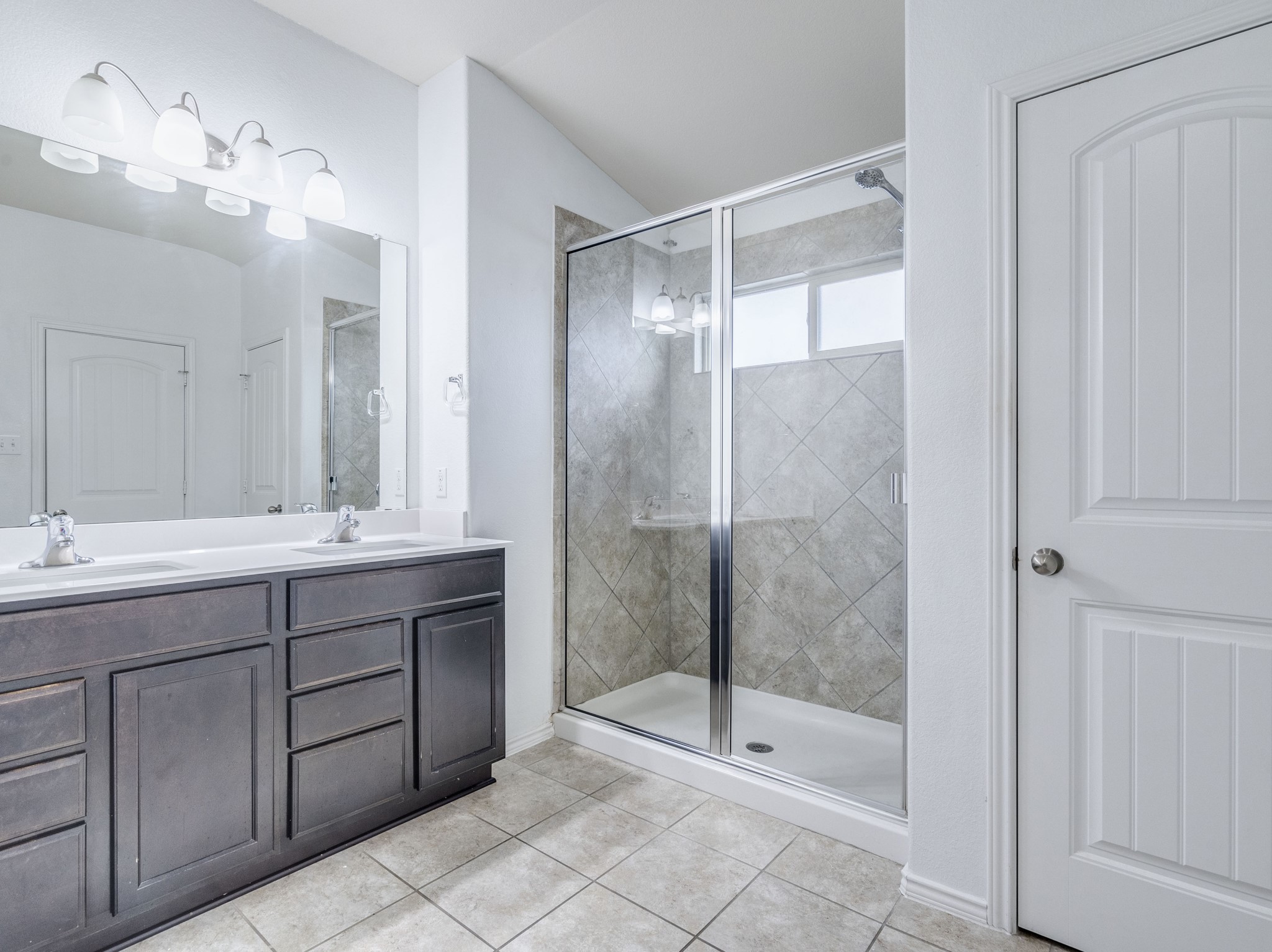 213 Ammonite Lane Jarrell, TX 76537 - Photo 20 of 34 a bathroom with a shower sink and mirror
