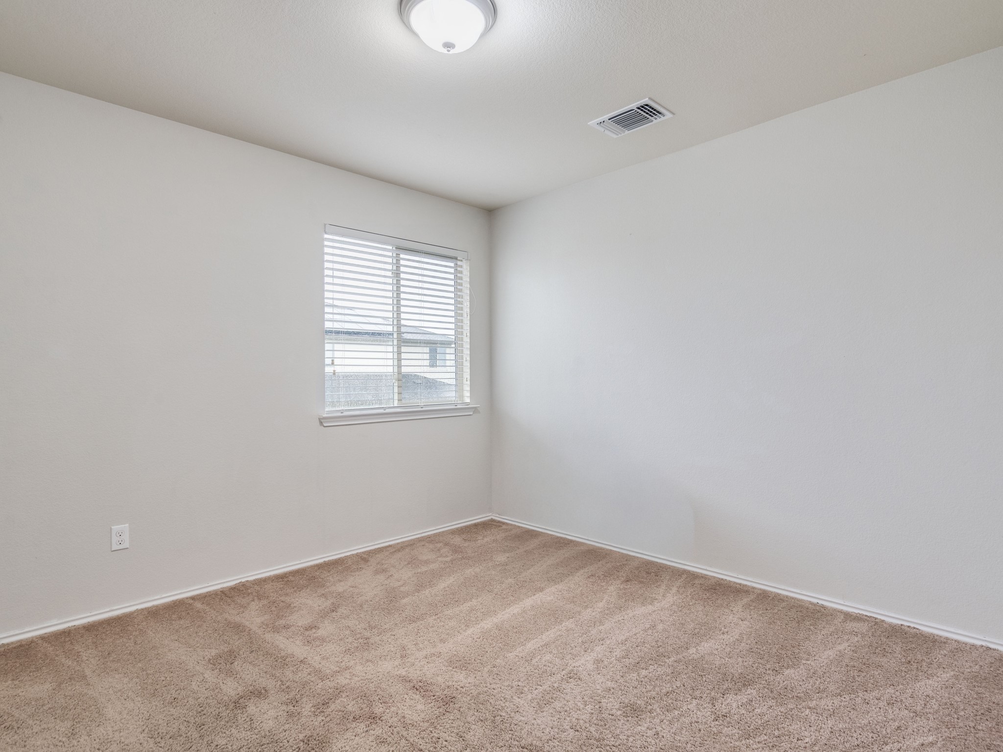 213 Ammonite Lane Jarrell, TX 76537 - Photo 24 of 34 an empty room with a window