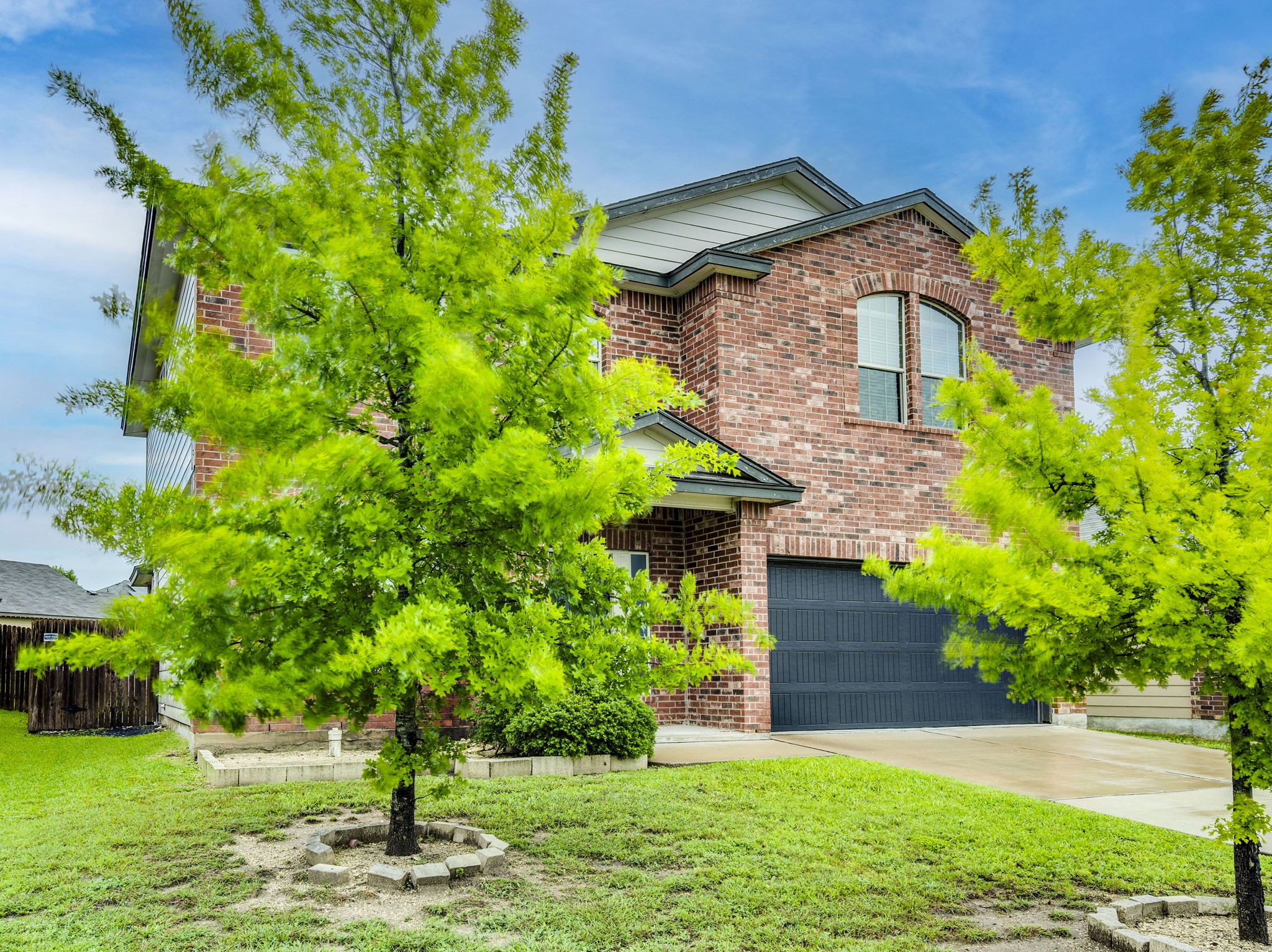 213 Ammonite Lane Jarrell, TX 76537 - Photo 3 of 34 a front view of a house with a yard