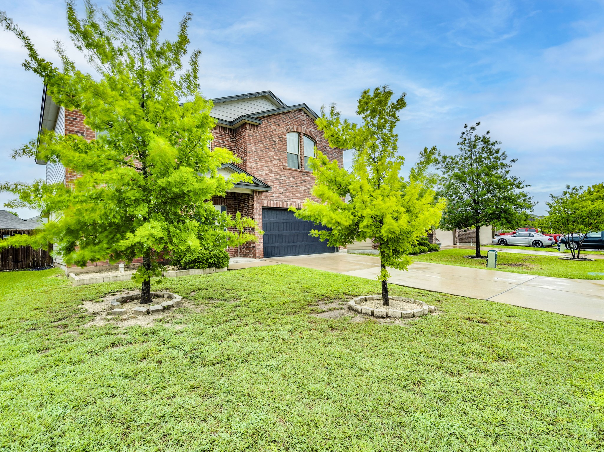213 Ammonite Lane Jarrell, TX 76537 - Photo 4 of 34 a house with garden in front of it