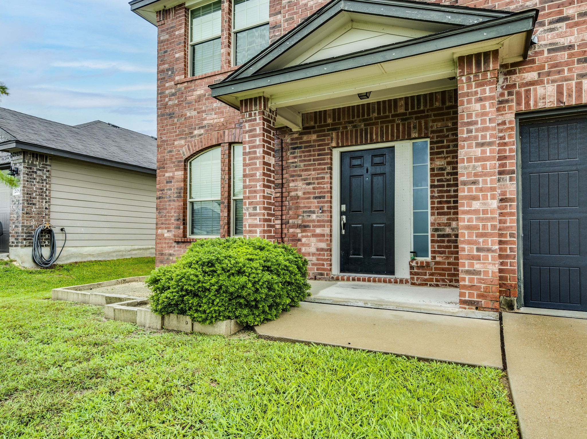 213 Ammonite Lane Jarrell, TX 76537 - Photo 6 of 34 a front view of a house with a yard