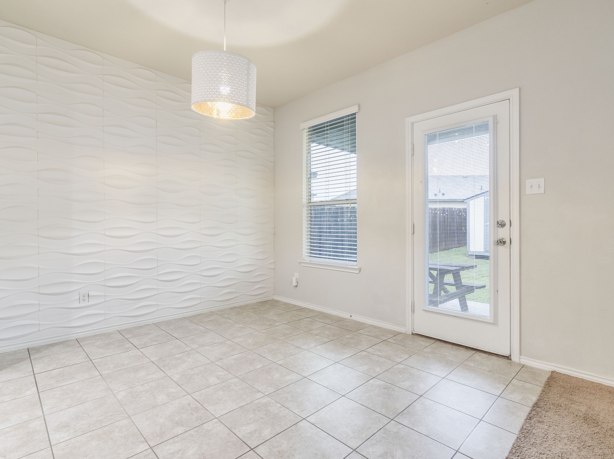 213 Ammonite Lane Jarrell, TX 76537 - Photo 10 of 34 an empty room with windows