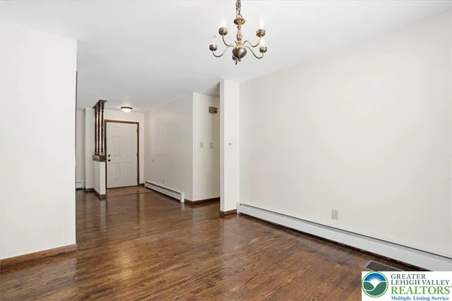 a kitchen with stainless steel appliances granite countertop wooden cabinets a stove a sink and a microwave