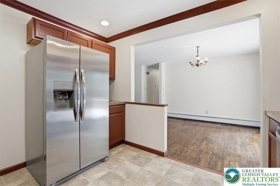 401 Highland Hill Road Jim Thorpe, PA 18235 - Photo 24 of 71 a view of a refrigerator in kitchen and an empty room